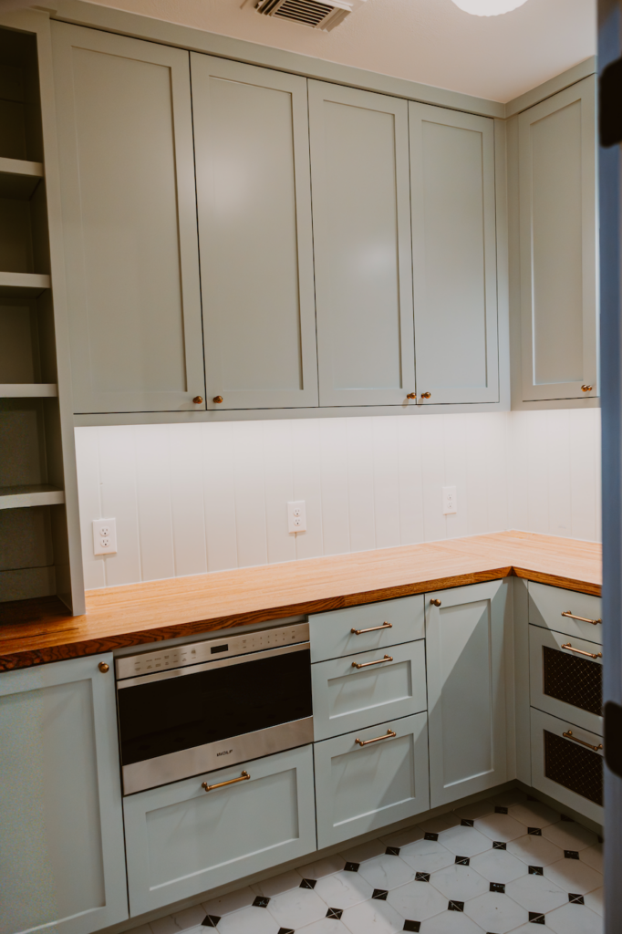 Butler's Pantry Featuring Frameless Cabinets with Soft Close Hardware in Seasalt