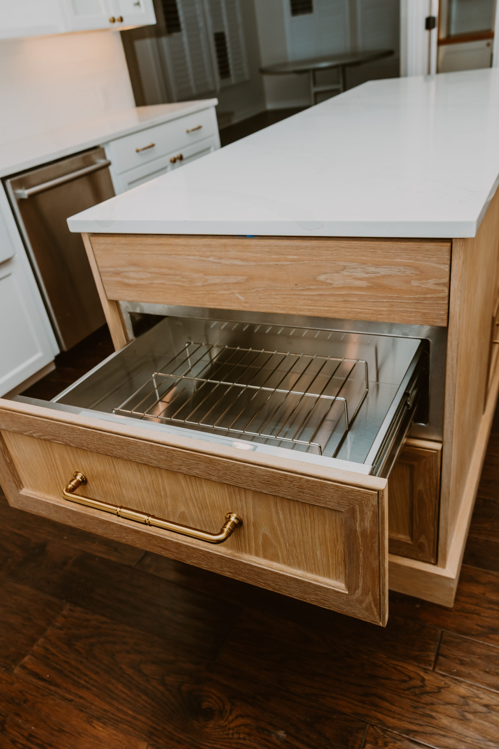 Warming Drawer Located in a White Oak Kitchen Island Warming Drawer Located in a White Oak Kitchen Island